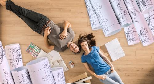 Homeowners laying on floor of home