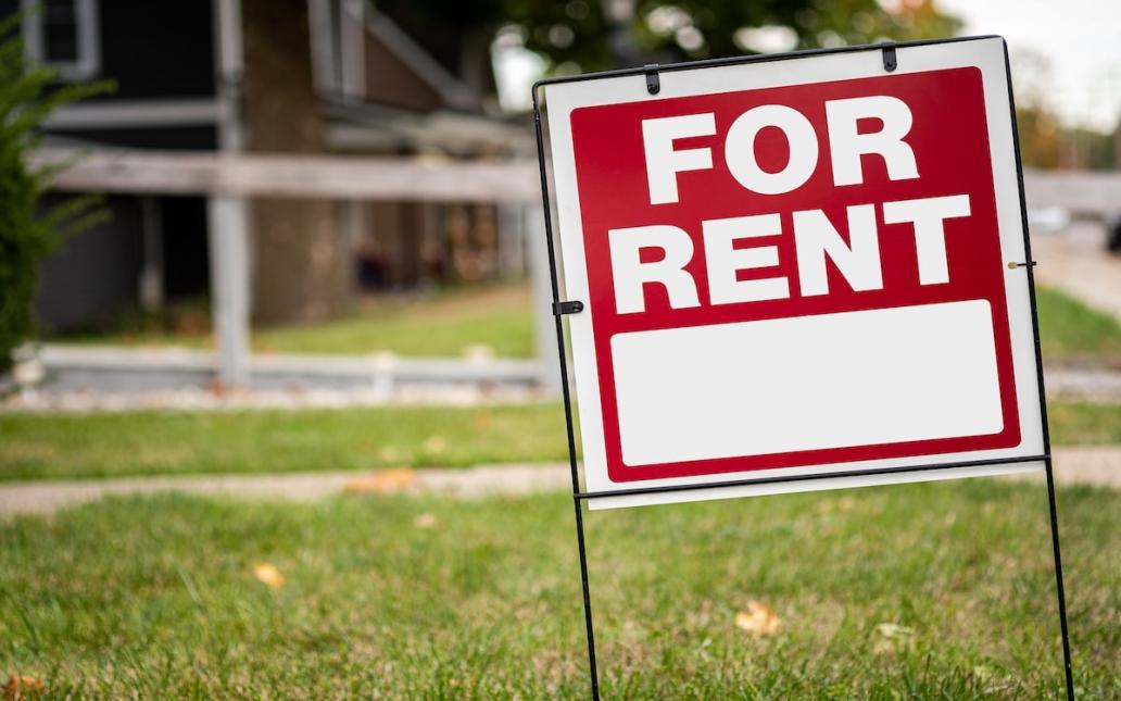 "For Rent" sign outside a rental home