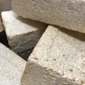 Bricks produced using mycelium, yard waste and wood chips as a part of the myco-architecture project. Similar materials could be used to build habitats on the Moon or Mars