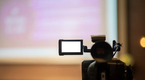 Video camera recording meeting